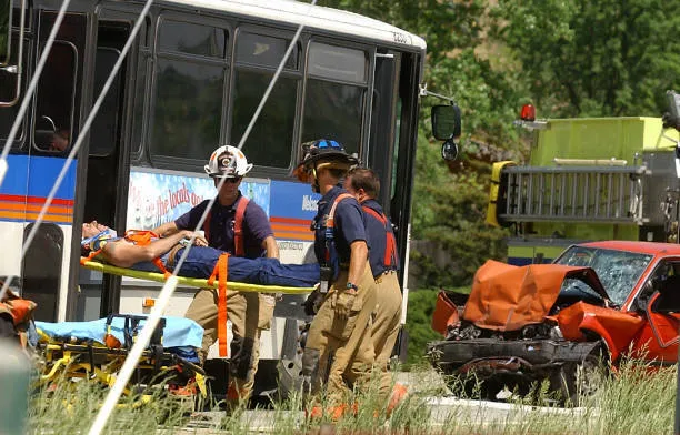 bus accident and person on stretcher